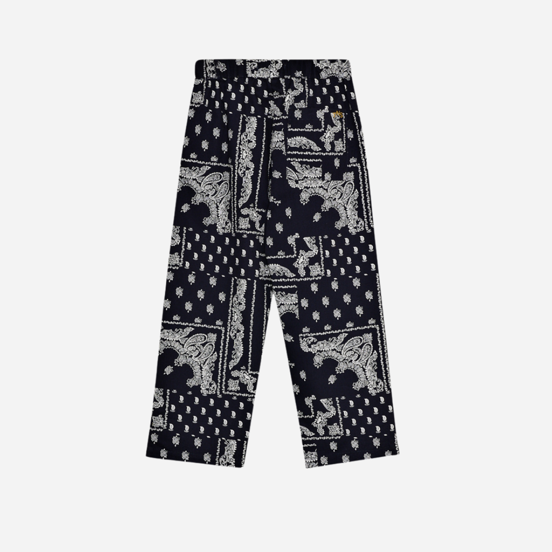 Sold at Bombon shop, these baby and toddler boy pants by The New Society feature a matching navy and white bandana print with an elastic waistband for an easy, comfortable fit—perfect for pairing with the coordinated shirt or mixing with basics. toddler version, back