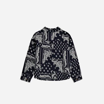 Sold at Bombon shop, this baby and toddler boy shirt by The New Society features a bold navy and white bandana-style print, long sleeves, front buttons, and a chest pocket embroidered with “TNS” for a stylish, laid-back look. toddler version, back