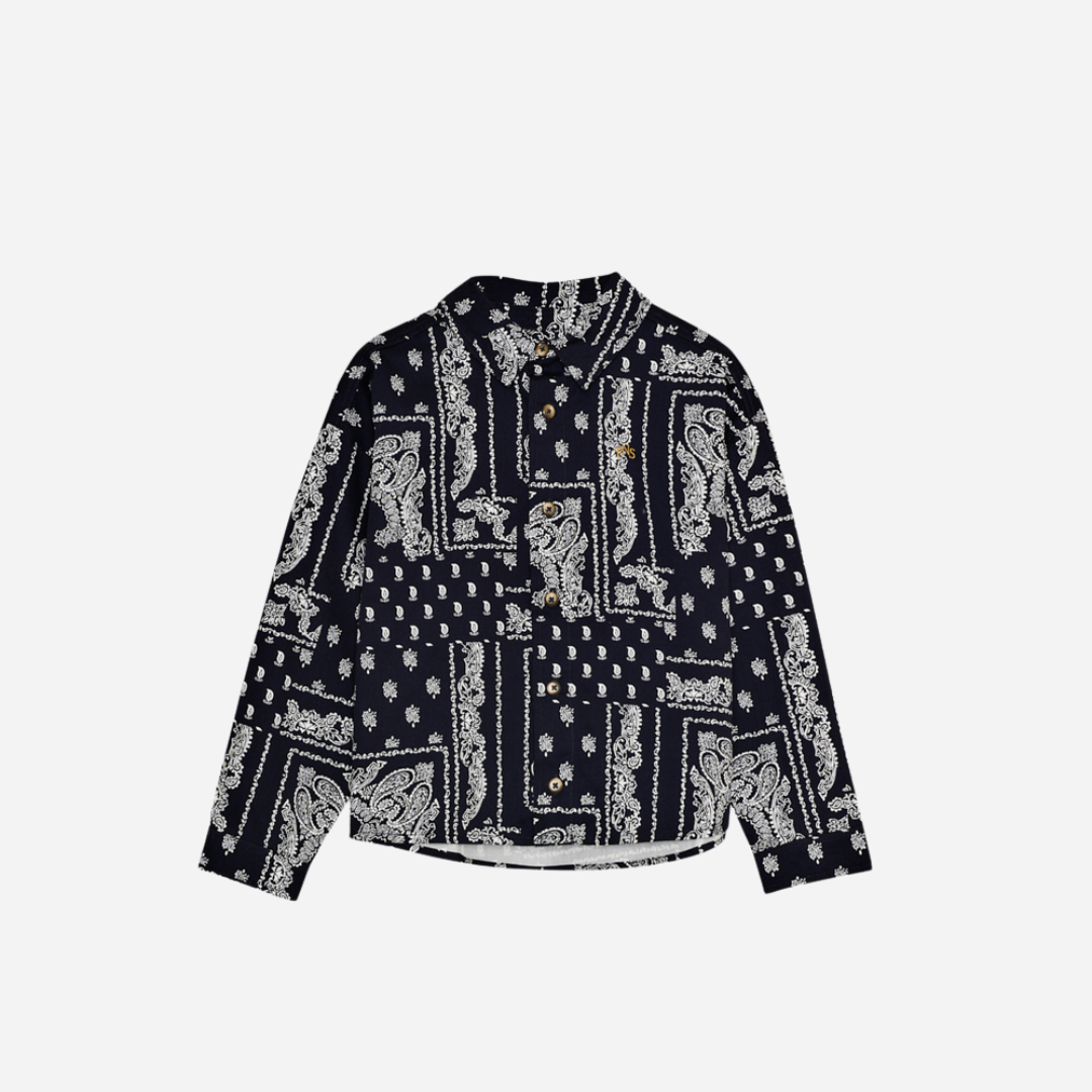 Sold at Bombon shop, this baby and toddler boy shirt by The New Society features a bold navy and white bandana-style print, long sleeves, front buttons, and a chest pocket embroidered with “TNS” for a stylish, laid-back look. toddler version, front