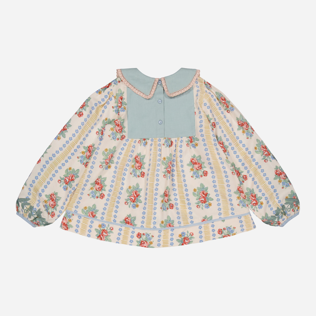 sold at Bombon shop, designed by Bachaa Blouse, 100% ECOVERO® Viscose, Block Print, Hand embroidered and lace trimmed collar, Hand embroidery on the sleeves, Contrasting tape, Gathers at the front and back, Long elasticated sleeves, Contrasting buttons and yoke at the back. back view
