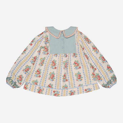 sold at Bombon shop, designed by Bachaa Blouse, 100% ECOVERO® Viscose, Block Print, Hand embroidered and lace trimmed collar, Hand embroidery on the sleeves, Contrasting tape, Gathers at the front and back, Long elasticated sleeves, Contrasting buttons and yoke at the back. back view