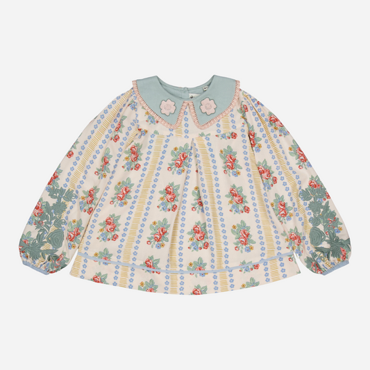 sold at Bombon shop, designed by Bachaa Blouse, 100% ECOVERO® Viscose, Block Print, Hand embroidered and lace trimmed collar, Hand embroidery on the sleeves, Contrasting tape, Gathers at the front and back, Long elasticated sleeves, Contrasting buttons and yoke at the back. front view
