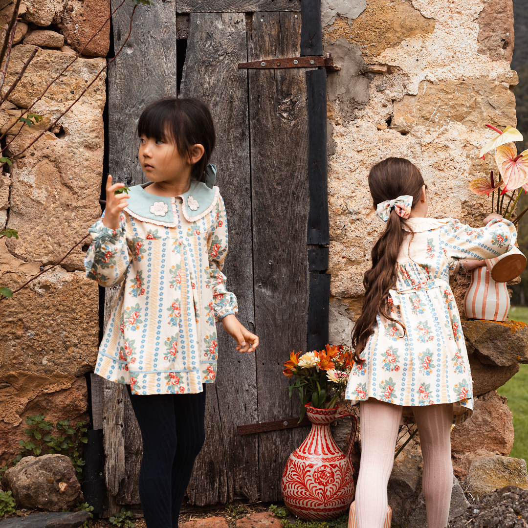 sold at Bombon shop, designed by Bachaa Blouse, 100% ECOVERO® Viscose, Block Print, Hand embroidered and lace trimmed collar, Hand embroidery on the sleeves, Contrasting tape, Gathers at the front and back, Long elasticated sleeves, Contrasting buttons and yoke at the back. model view