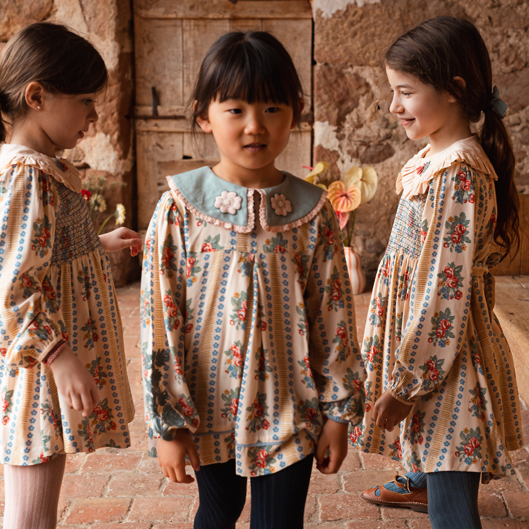 sold at Bombon shop, designed by Bachaa Blouse, 100% ECOVERO® Viscose, Block Print, Hand embroidered and lace trimmed collar, Hand embroidery on the sleeves, Contrasting tape, Gathers at the front and back, Long elasticated sleeves, Contrasting buttons and yoke at the back. model view