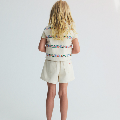 sold at Bombon, designed by The New Society natural denim kids waistcoat with multicolor floral embroidery in 100% BCI cotton matching shorts set