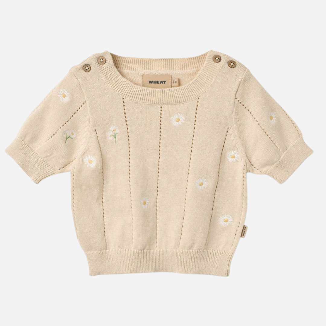 Sold at Bombon Shop, designed by Wheat, sandshell white flowers organic cotton short sleeve knit top with delicate floral knit detailing.
