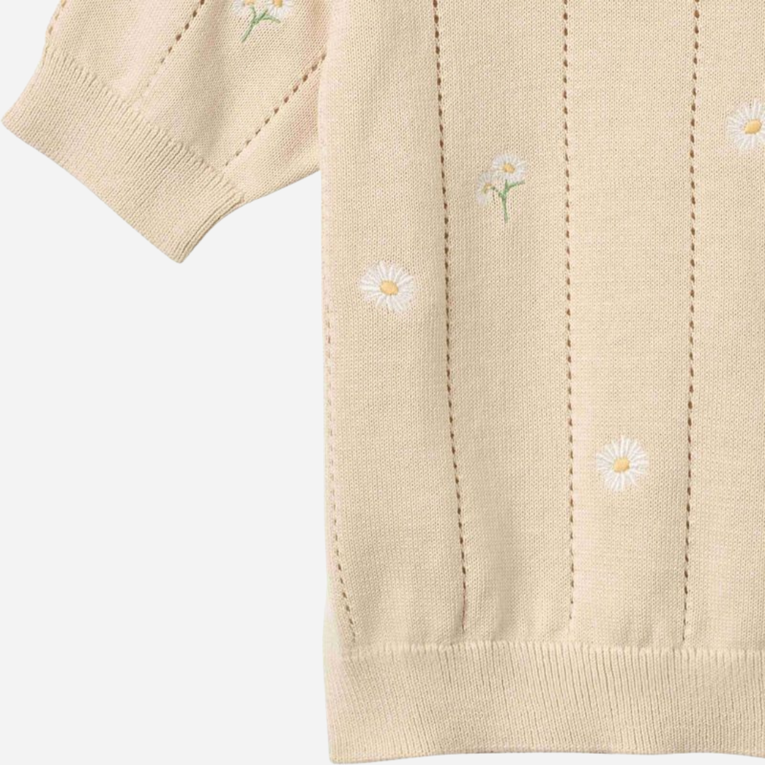 Sold at Bombon Shop, designed by Wheat, sandshell white flowers organic cotton short sleeve knit sweater with floral knit pattern and soft neutral tone.