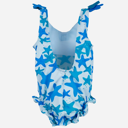 sold at Bombon shop, designed by Al Agua Patos Brand, this star print baby one piece swim suit in blue is perfect for summer. Back view