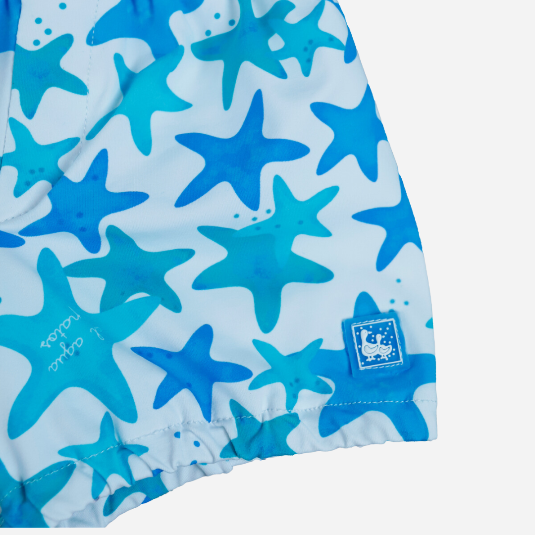 sold at Bombon shop, designed by Al Agua Patos Brand, this star print baby boy swim short in blue is perfect for summer. Zoom view