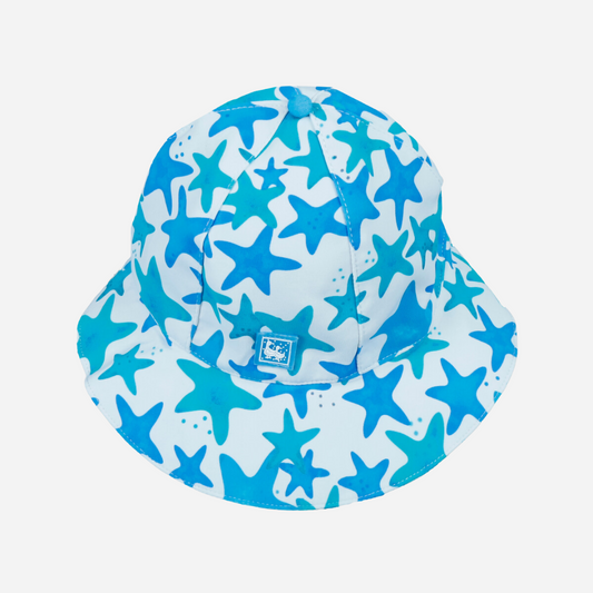 sold at Bombon shop, designed by Al Agua Patos Brand, this star print baby hat provides sun coverage and is waterproof. Perfect for summer.