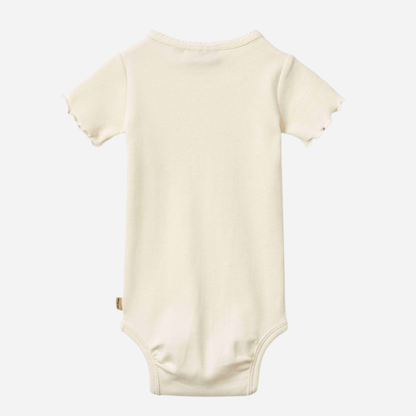 Sold at Bombon Shop, designed by Wheat, ivory organic cotton short sleeve baby bodysuit with a soft minimal silhouette.