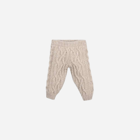 Sold at Bombon shop, these baby pants by The New Society feature a cozy cable knit texture with an elasticated waist and cuffs for a comfortable everyday fit. front