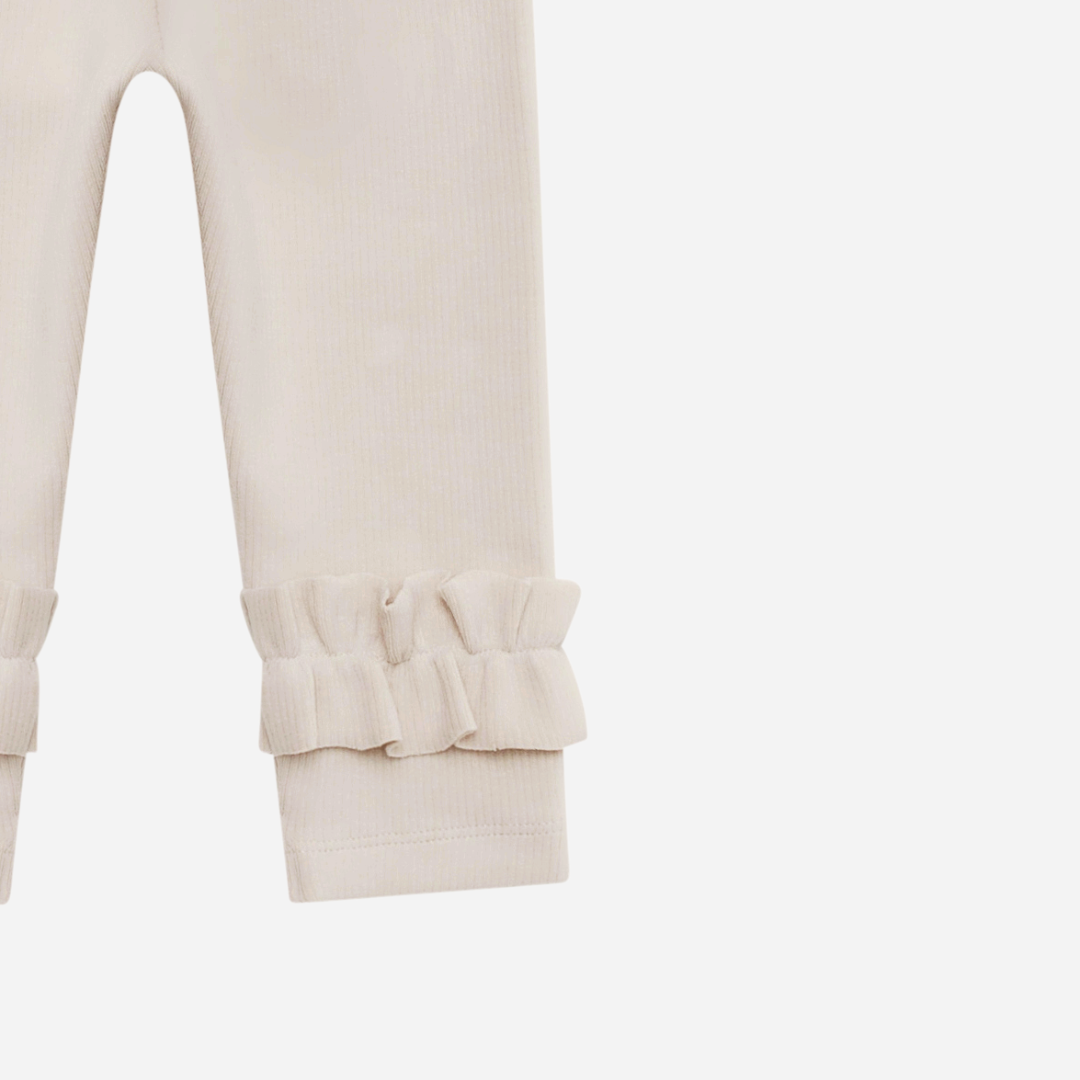 Sold at Bombon shop, designed by Donsje from Amsterdam, these leggings in a soft sand color and ruffle detail in the bottom leg for baby gris and toddler are the perfect piece for pre fall all the way through winter.  leg detail
