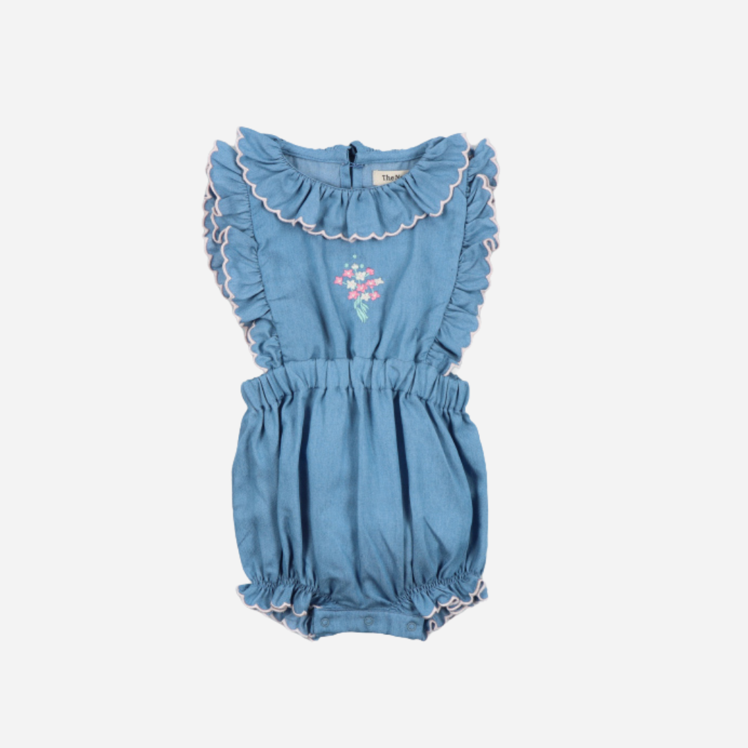 sold at Bombon, designed by The New Society light blue chambray baby romper with ruffle shoulders in 100% cotton soft breathable summer outfit