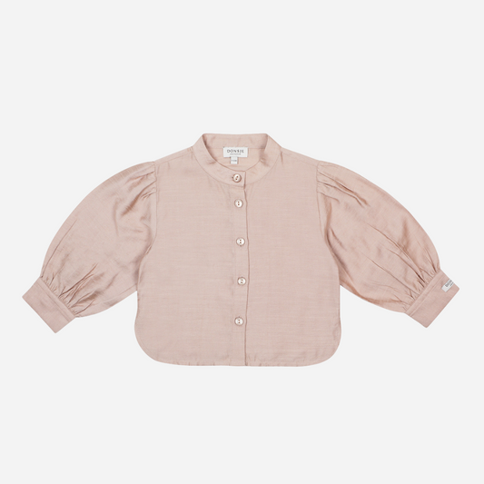 Sold at Bombon shop, designed by Donsje from Amsterdam, this baby and toddler pale rose colored blouse goes with everything. Perfect for pre fall all the way through winter.  front view