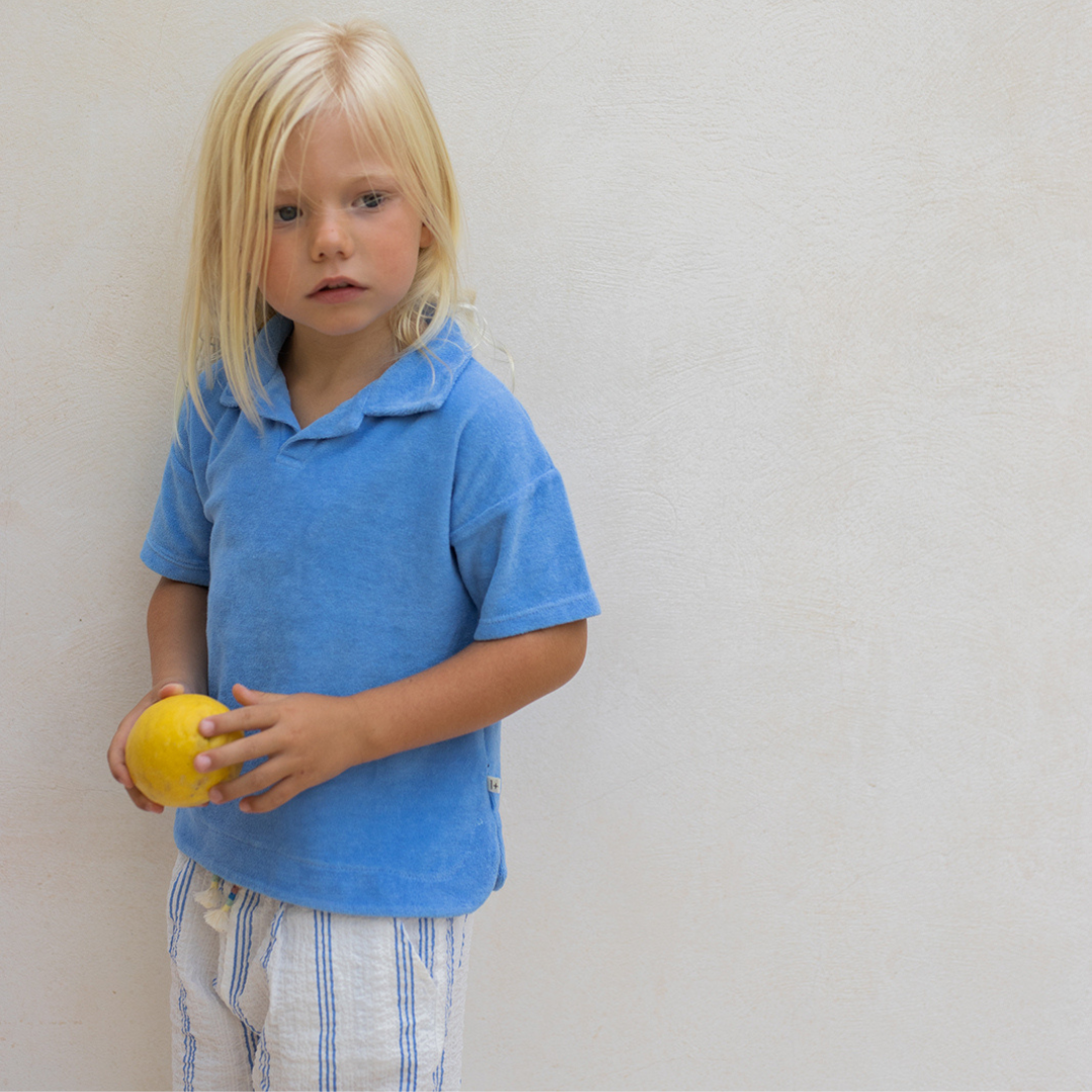 Sold at Bombon Shop, designed by 1+ in the family, ultramarine striped baby pants with elastic waistband and soft cotton fabric.