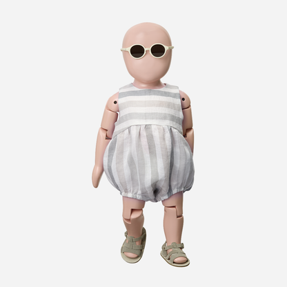 Sold at Bombon Shop, designed by 1+ in the family, beige striped baby romper with soft cotton fabric and relaxed silhouette.