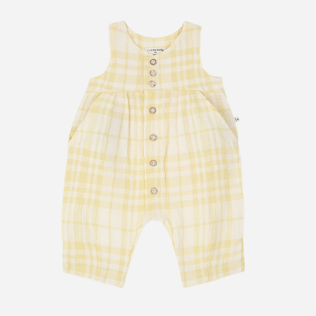 Sold at Bombon Shop, designed by 1+ in the family, lemon check baby overall with front button detail and soft cotton fabric.