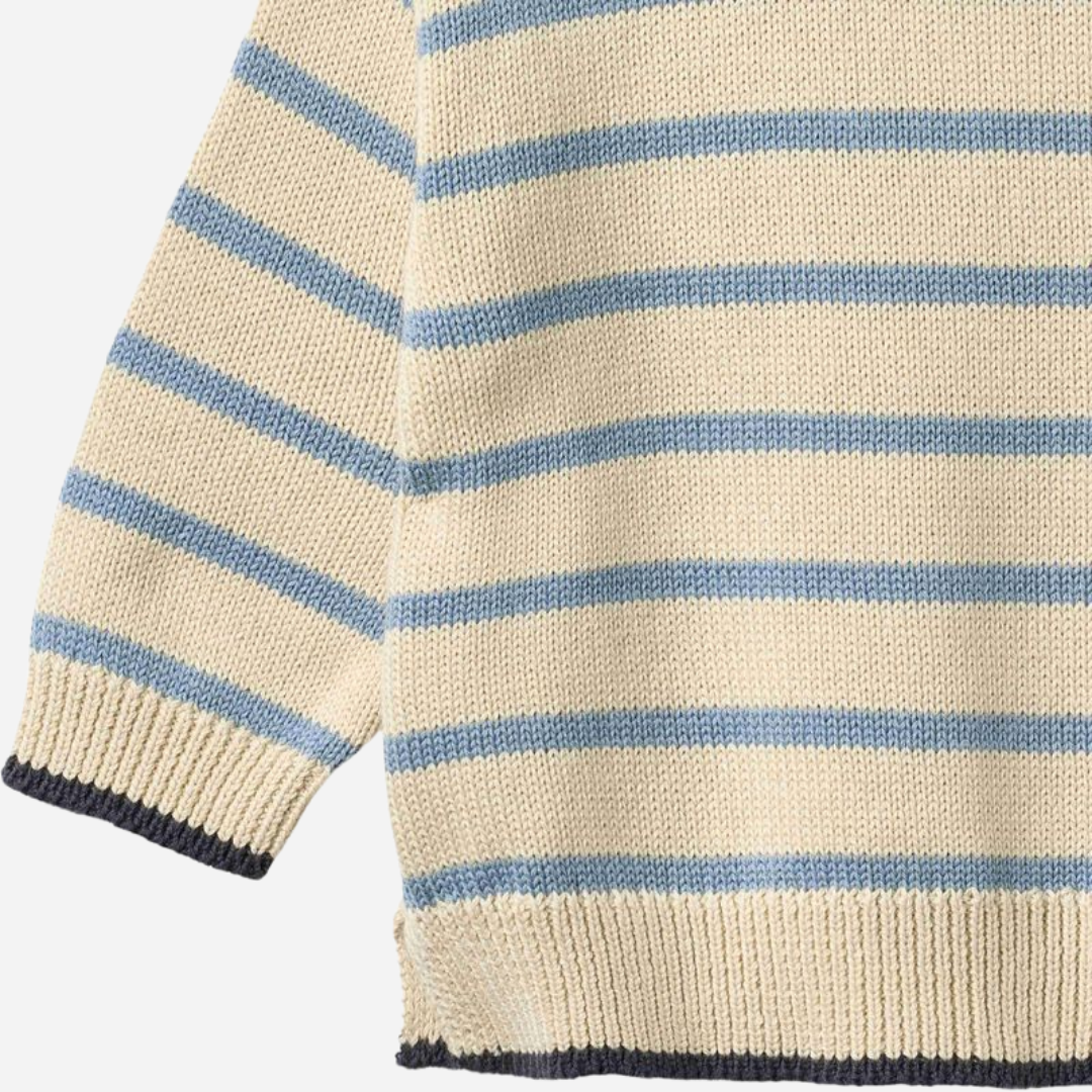 Sold at Bombon Shop, designed by Wheat, faded denim stripe organic cotton knit pullover with soft blue and neutral horizontal stripes.
