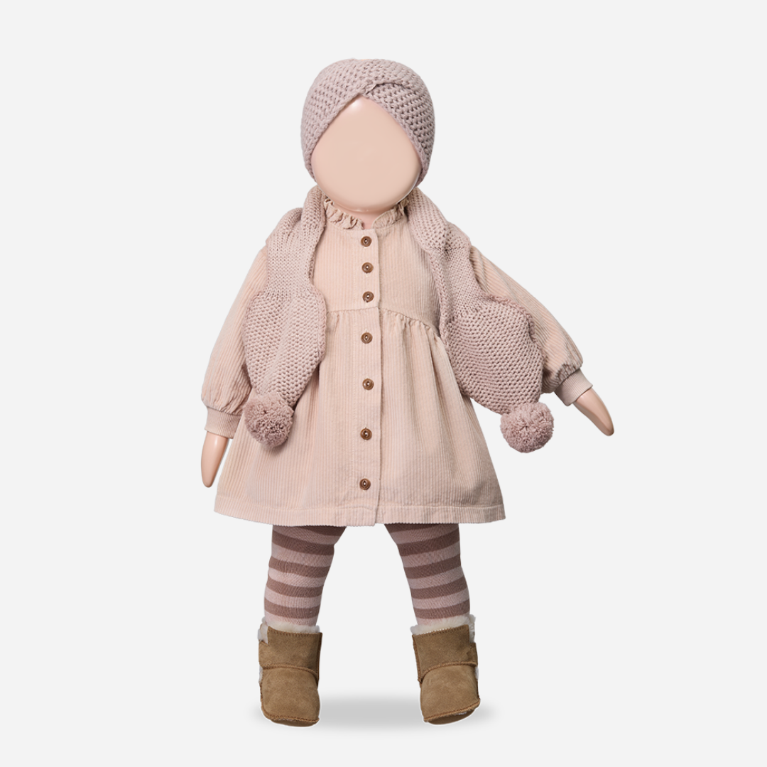 Sold at Bombon shop, designed by 1+ in the family — nude corduroy baby dress with front buttons. mannequin