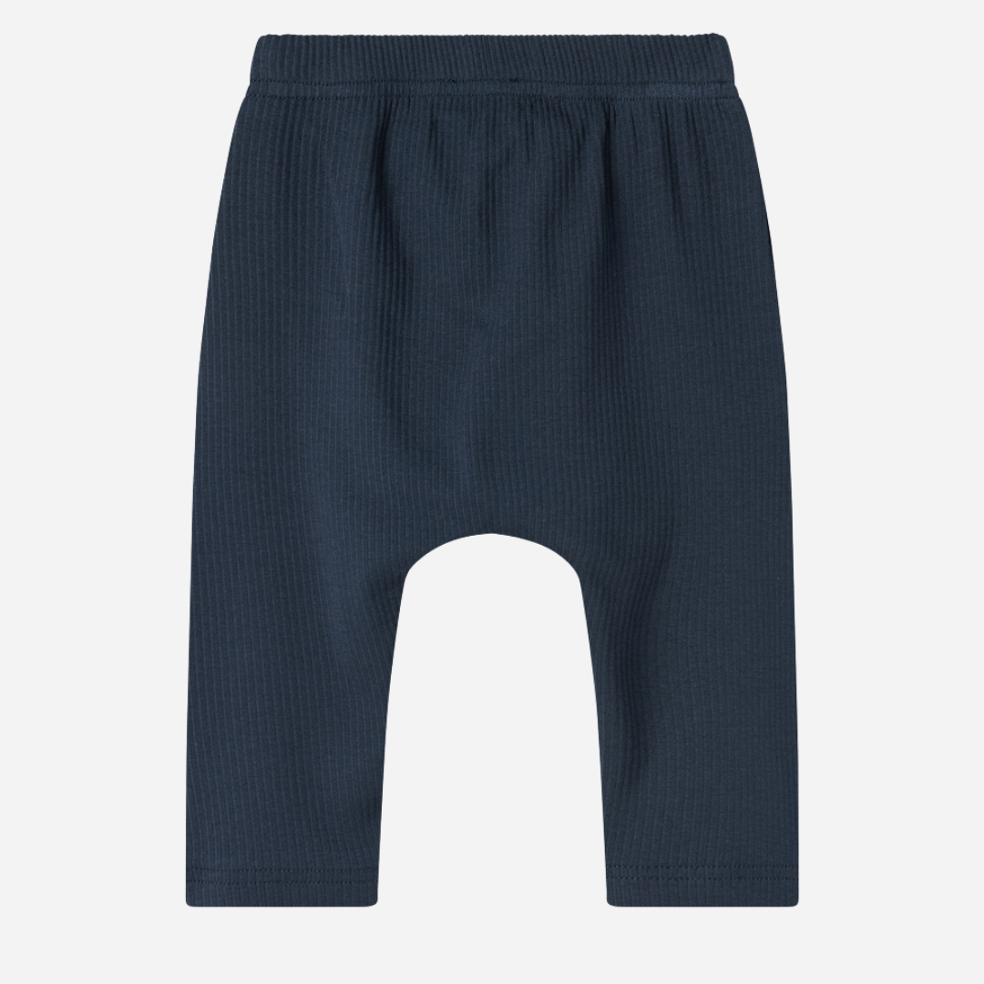 Sold at Bombon shop, designed by MarMar Copenhagen — navy ribbed organic cotton baby pants with drawstring, part of a matching set.