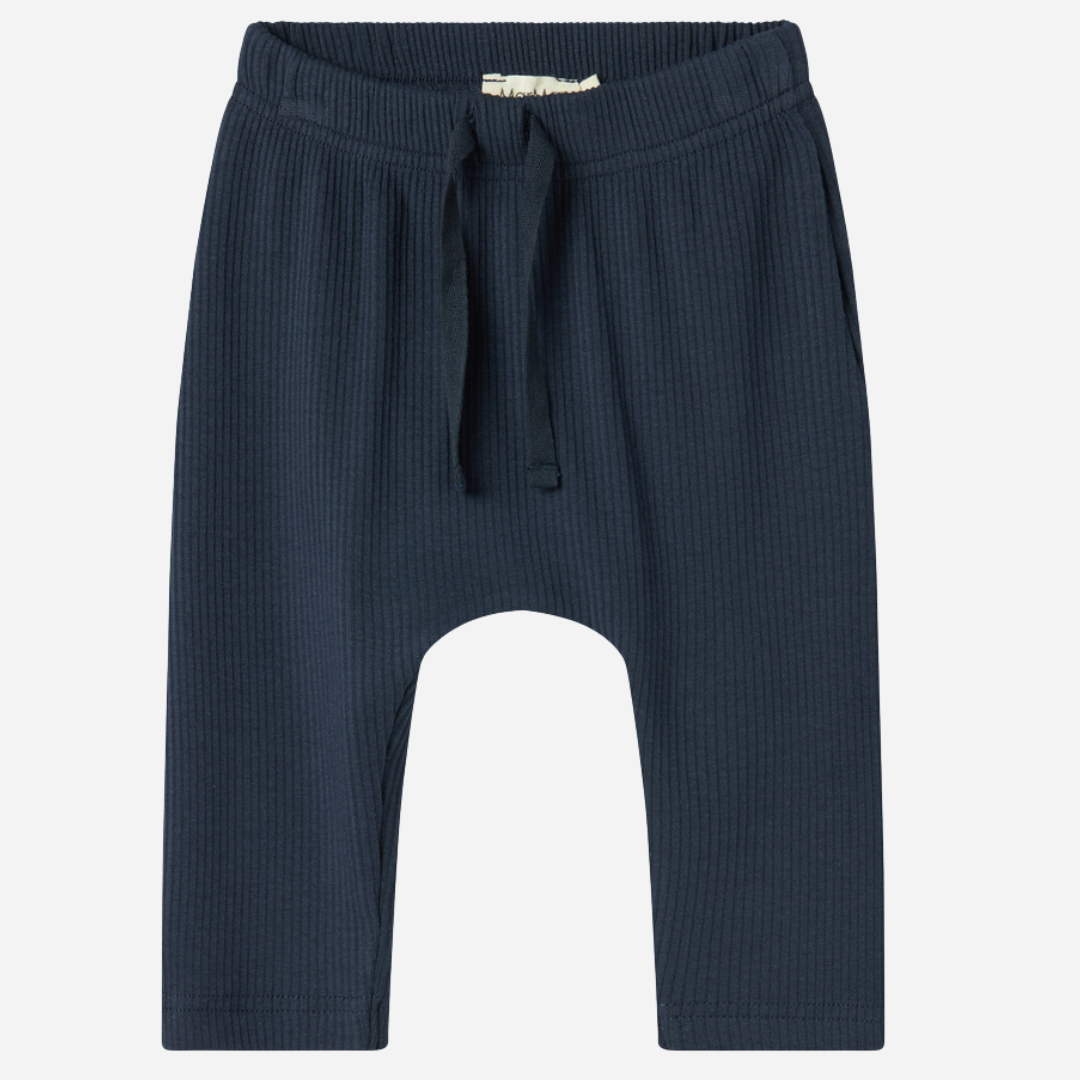 Sold at Bombon shop, designed by MarMar Copenhagen — navy ribbed organic cotton baby pants with drawstring, part of a matching set.