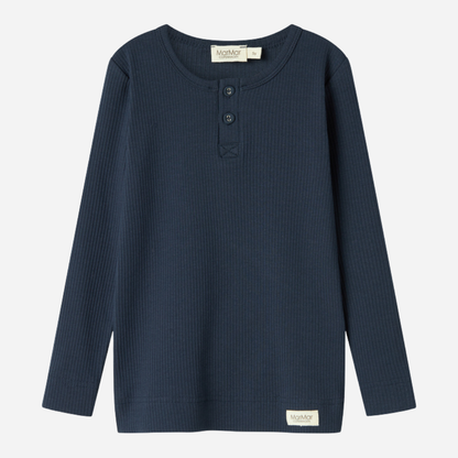 Sold at Bombon shop, designed by MarMar Copenhagen — navy ribbed organic cotton long-sleeve baby top with buttoned neckline, part of a matching set.