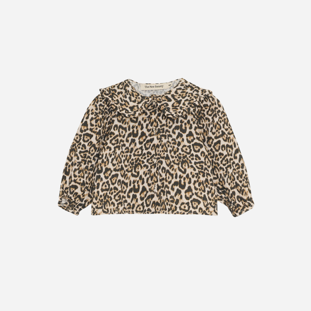 Sold at Bombon shop, designed by The New Society, this baby girl blouse features an all-over leopard print, ruffled collar, and long sleeves for a stylish, standout look. front