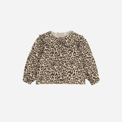 Sold at Bombon shop, designed by The New Society, this baby girl blouse features an all-over leopard print, ruffled collar, and long sleeves for a stylish, standout look. front