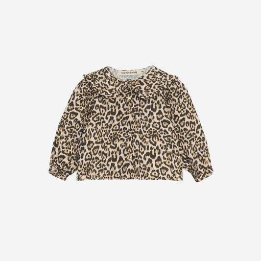 Sold at Bombon shop, designed by The New Society, this baby girl blouse features an all-over leopard print, ruffled collar, and long sleeves for a stylish, standout look. front