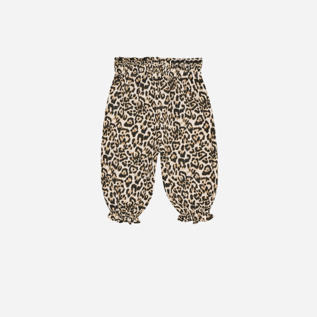 Sold at Bombon shop, designed by The New Society, these baby girl pants feature an all-over leopard print with an elastic waistband and gathered hems for a comfy, playful fit. back