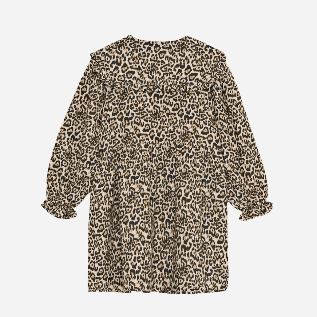 Sold at Bombon shop, this girls’ dress by The New Society features an all-over leopard print, ruffled collar, long sleeves with gathered cuffs, and a tiered silhouette for a bold and playful look. back view