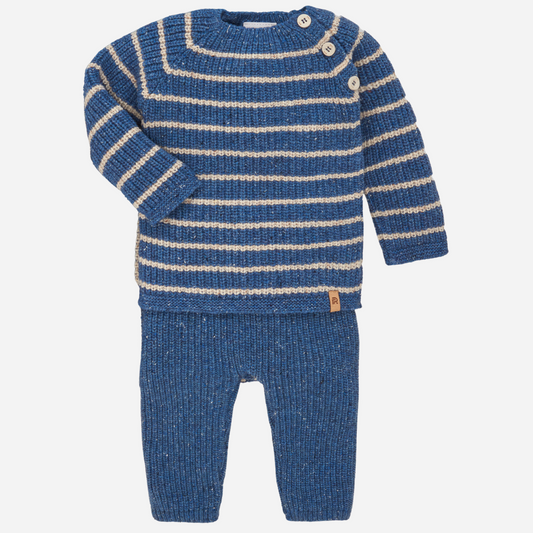 Sold at Bombon shop, designed by Paz Rodriguez, blue and cream striped knit baby set with buttoned sweater and matching pants.