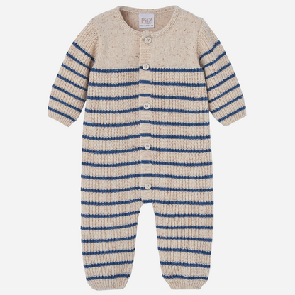 Sold at Bombon shop, designed by Paz Rodriguez, beige knit baby jumpsuit with blue horizontal stripes and front button closure.