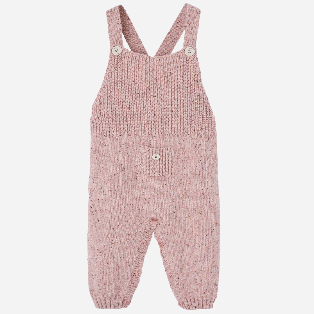 Sold at Bombon shop, designed by Paz Rodriguez. Cream floral muslin baby bodysuit with ruffle collar paired with pink knit overalls featuring front pocket and button straps.