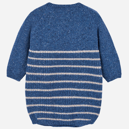 Sold at Bombon shop, designed by Paz Rodriguez, blue knit baby romper with cream horizontal stripes and shoulder buttons.