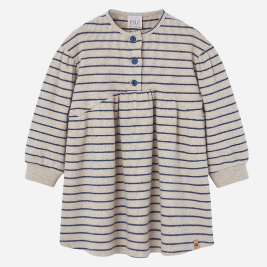 Sold at Bombon shop, designed by Paz Rodriguez, cream and navy striped knit dress with gathered waist and three-button front.