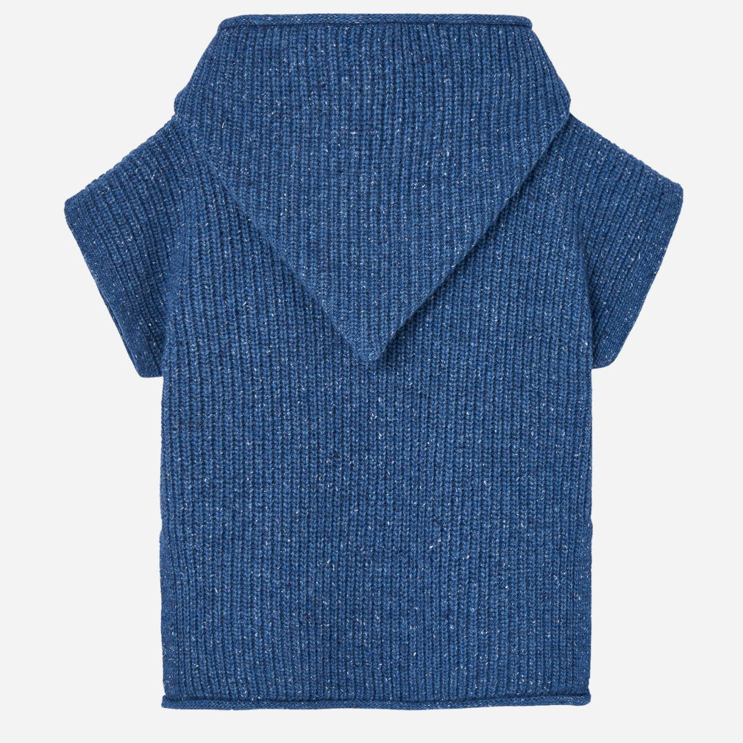 Sold at Bombon shop, designed by Paz Rodriguez, blue speckled knit vest with hood and tie neckline.