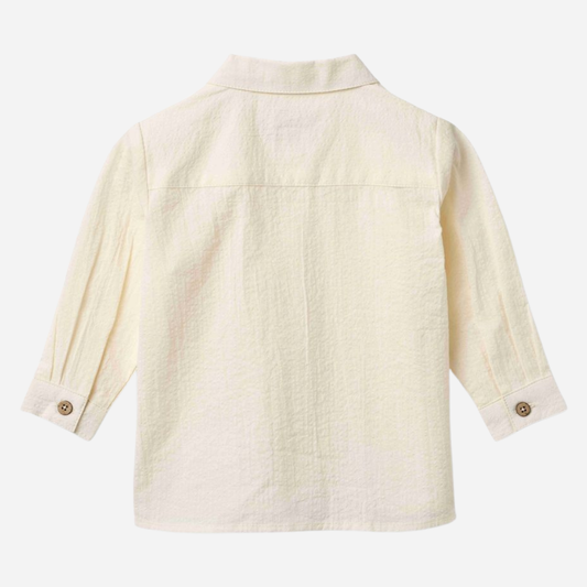Sold at Bombon Shop, designed by Wheat, ivory organic cotton long sleeve button-down shirt with classic collar and clean silhouette.