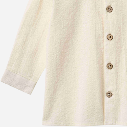 Sold at Bombon Shop, designed by Wheat, ivory organic cotton long sleeve button-down shirt with classic collar and clean silhouette.