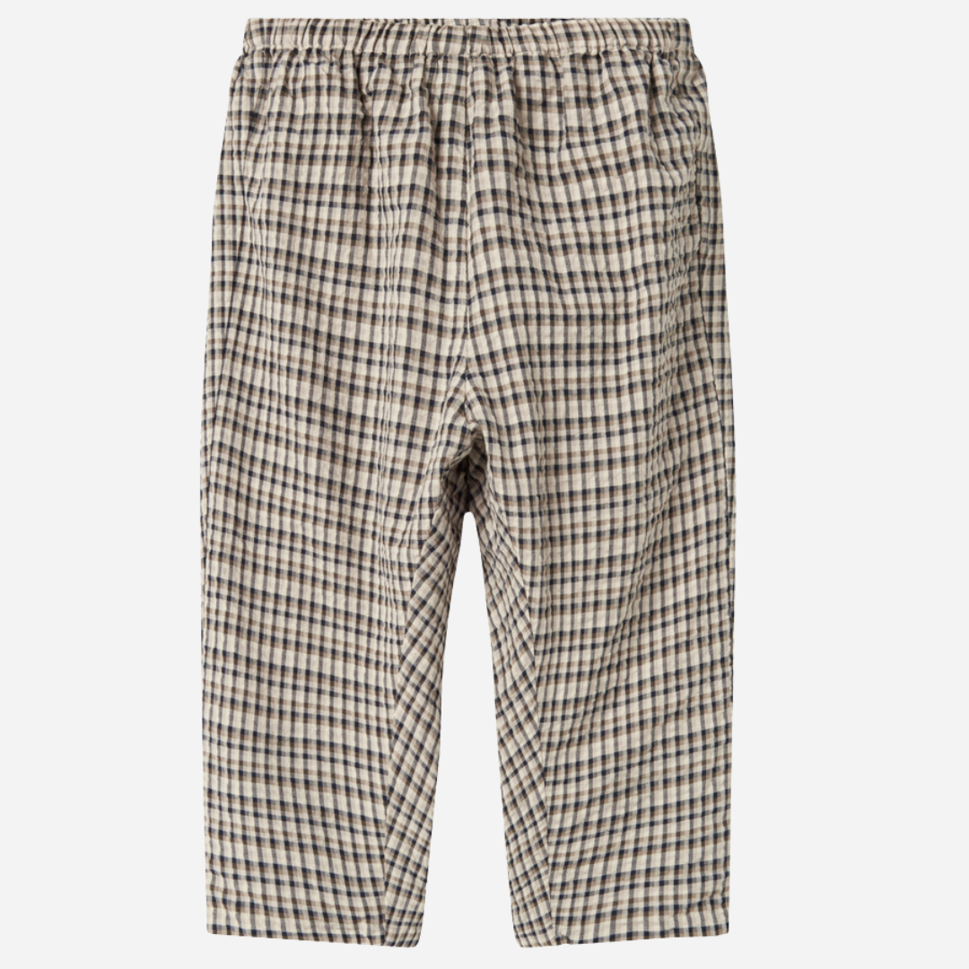 Sold at Bombon shop, designed by MarMar Copenhagen. Beige and navy check cotton pants with elastic waistband, pair perfectly with the matching beige shirt.