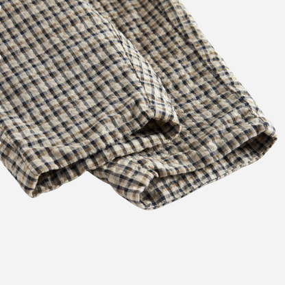 Sold at Bombon shop, designed by MarMar Copenhagen. Beige and navy check cotton pants with elastic waistband, pair perfectly with the matching beige shirt.