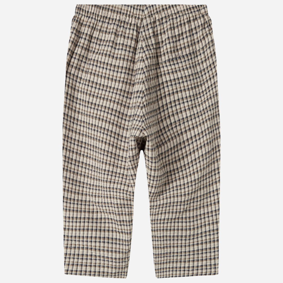Sold at Bombon shop, designed by MarMar Copenhagen. Beige and navy check cotton pants with elastic waistband, pair perfectly with the matching beige shirt.
