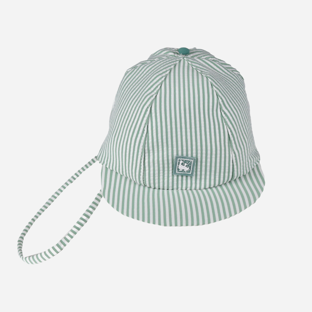 sold at Bombon shop, designed by Al Agua Patos Brand, this green and white striped cap provides sun coverage and is waterproof. Perfect for summer. front view