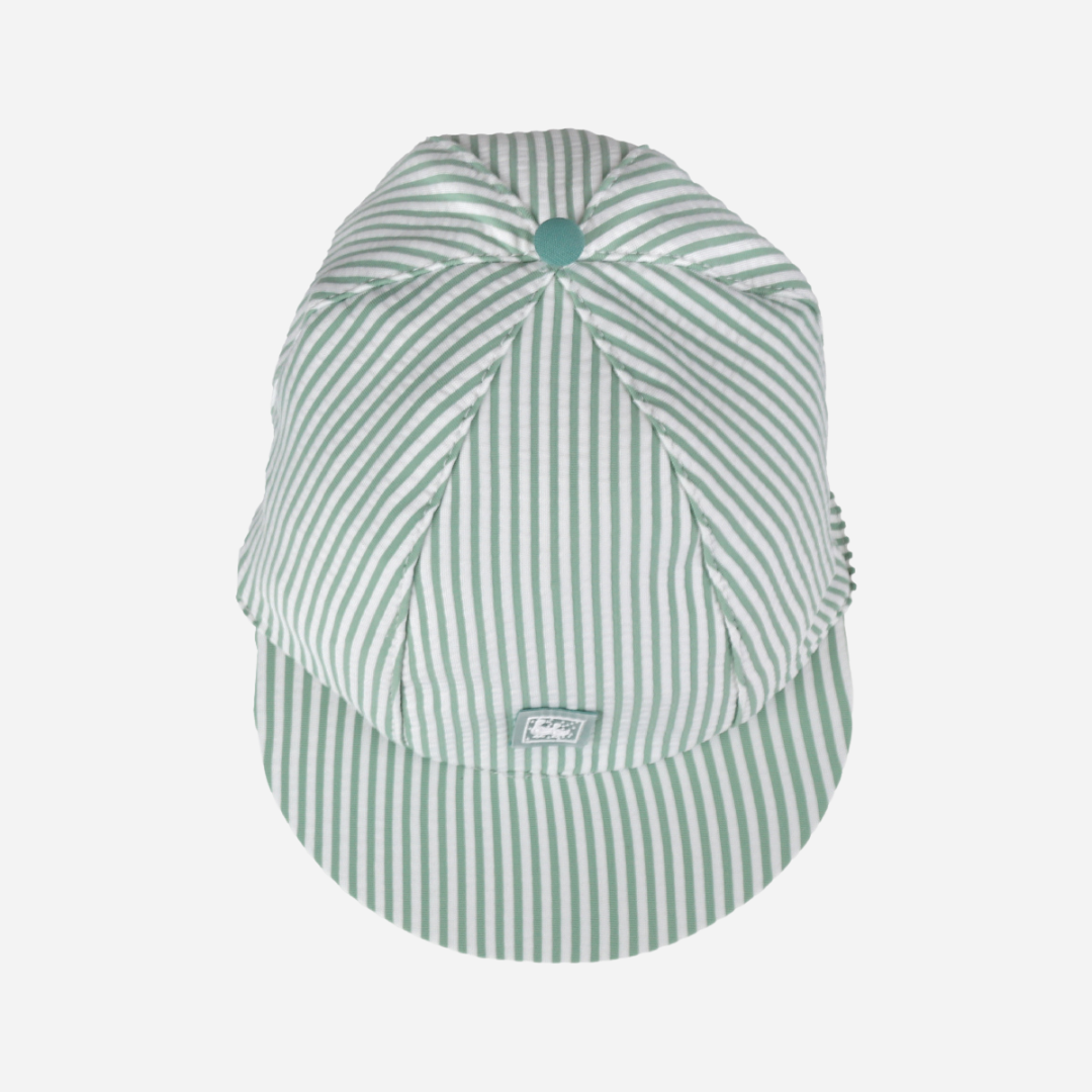 sold at Bombon shop, designed by Al Agua Patos Brand, this green and white striped cap provides sun coverage and is waterproof. Perfect for summer. top view