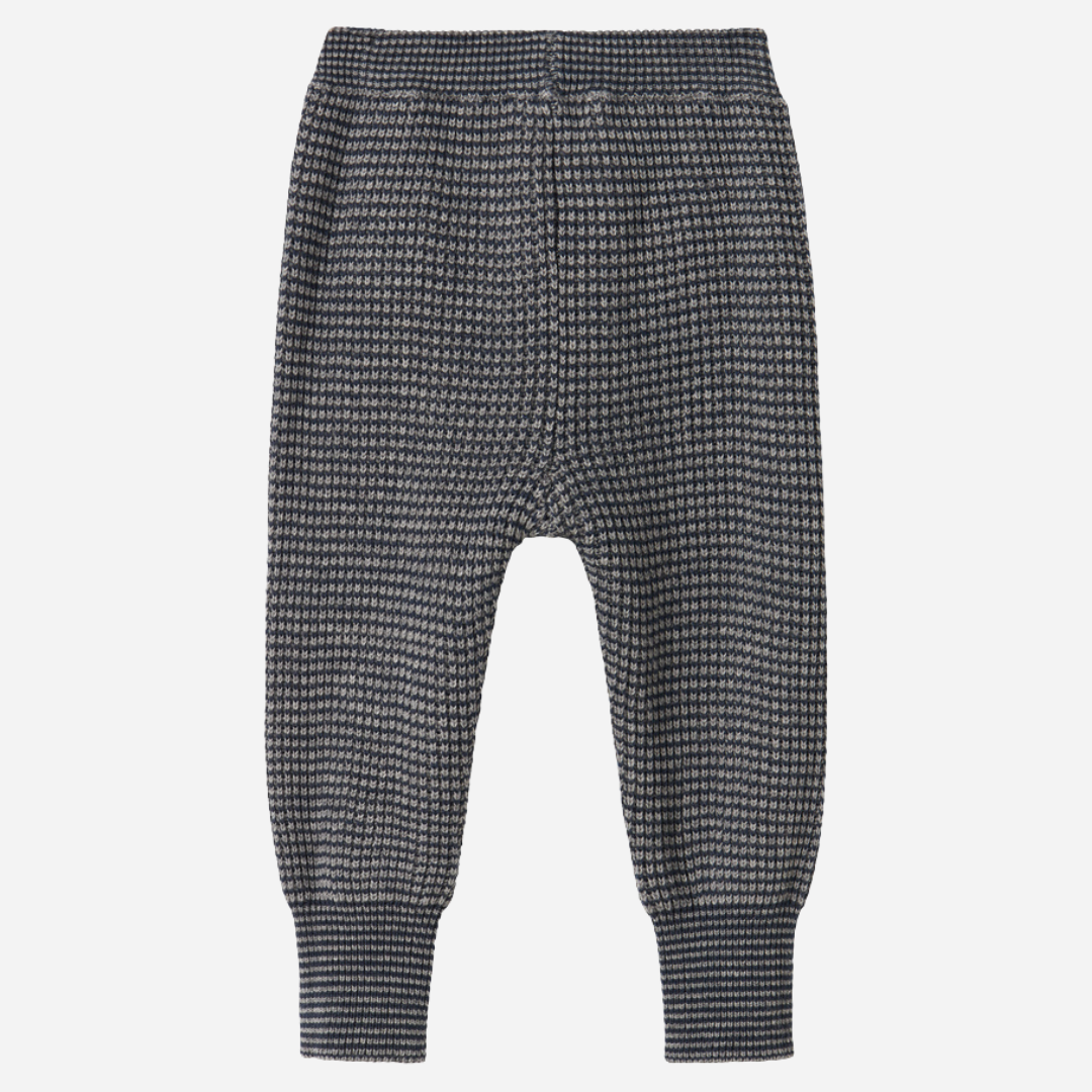 Sold at Bombon shop, designed by MarMar Copenhagen. Blue and beige textured knit baby pants with ribbed cuffs, pair perfectly with the matching knit sweater.