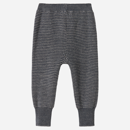 Sold at Bombon shop, designed by MarMar Copenhagen. Blue and beige textured knit baby pants with ribbed cuffs, pair perfectly with the matching knit sweater.