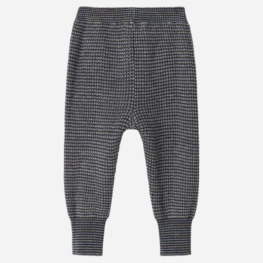 Sold at Bombon shop, designed by MarMar Copenhagen. Blue and beige textured knit baby pants with ribbed cuffs, pair perfectly with the matching knit sweater.