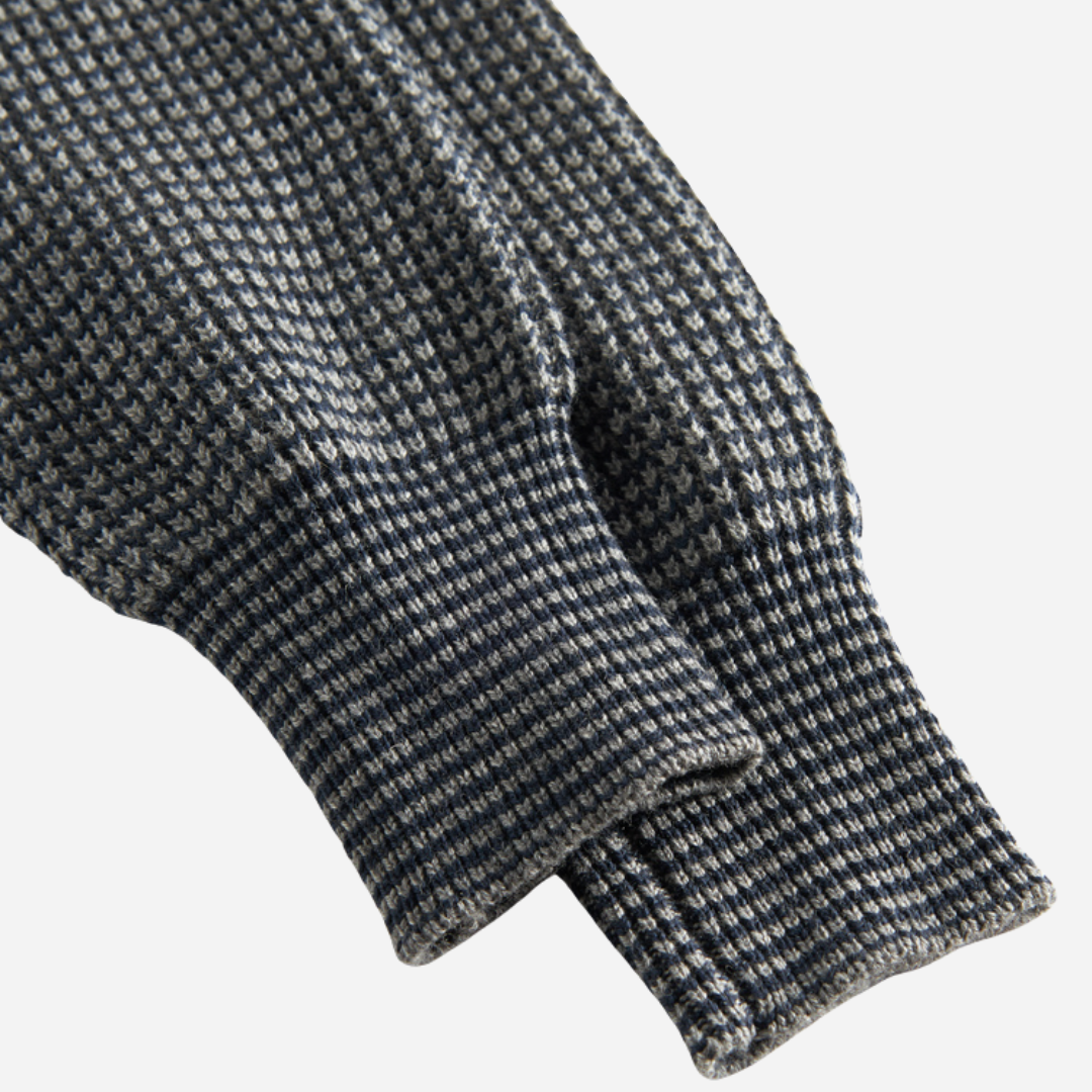 Sold at Bombon shop, designed by MarMar Copenhagen. Blue and beige textured knit baby pants with ribbed cuffs, pair perfectly with the matching knit sweater.