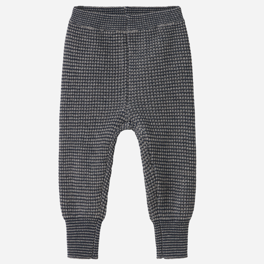 Sold at Bombon shop, designed by MarMar Copenhagen. Blue and beige textured knit baby pants with ribbed cuffs, pair perfectly with the matching knit sweater.
